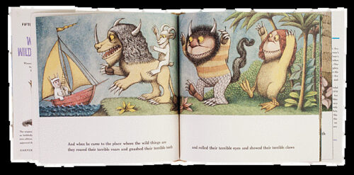 Un álbum ilustrado abierto con una escena de Maurice Sendak